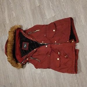 "Very Chic" Sleeveless Hooded Ladies Jacket with Stylish Split in Back.